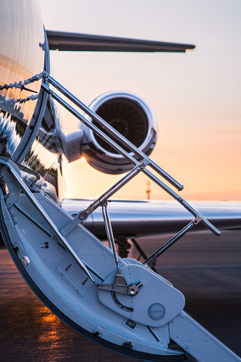 Business jet airstair at sunset